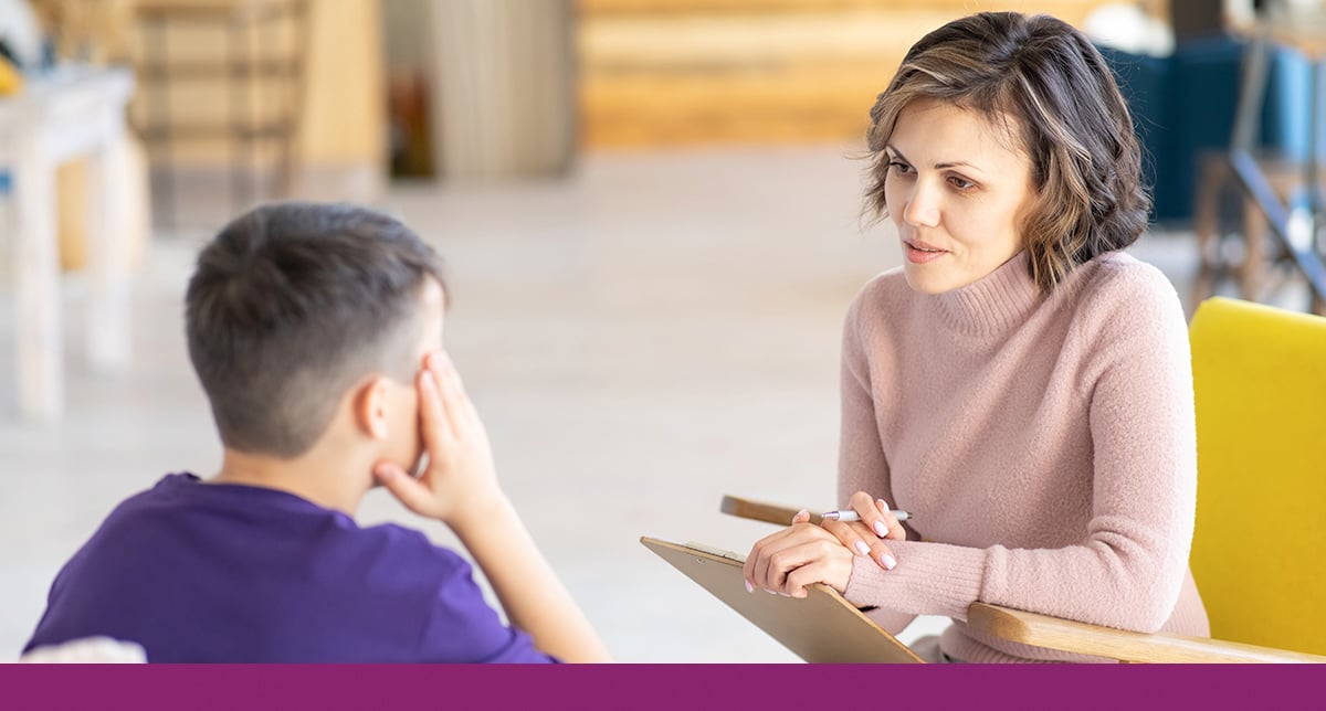 A Counselor Speaks with a Student at School